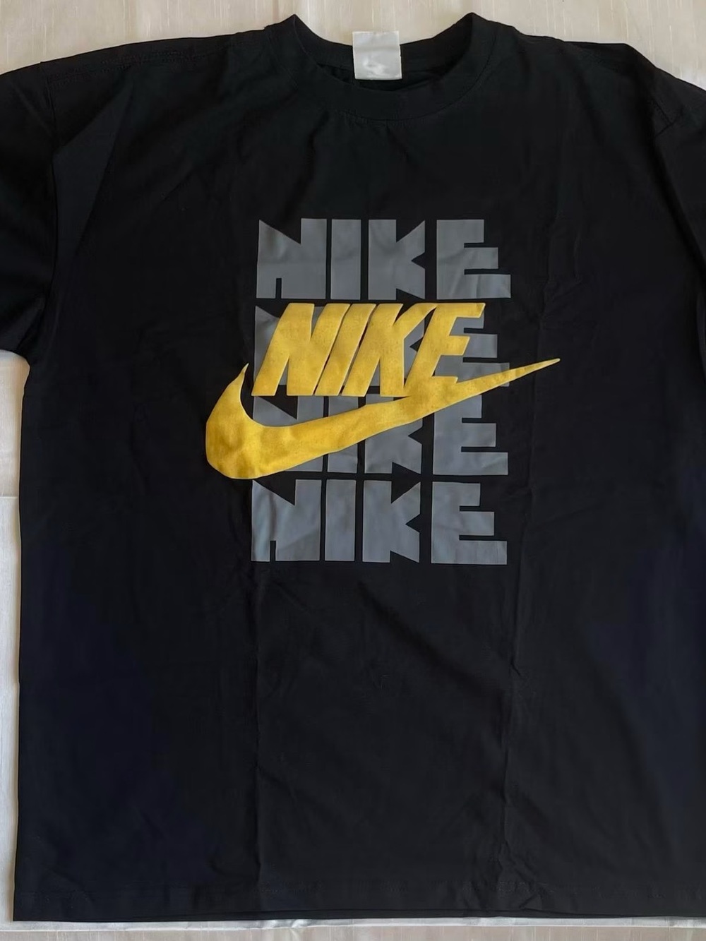 Nike Black Short-Sleeve Tee with Gold Swoosh and Gray Logo Block